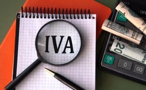 IVA - acronym under magnifying glass showcasing the ultimate IVA guide