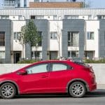 Parked red car showcasing the affect of an IVA on your car