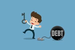 Happy man unlocks the chain from the steel metal ball to free debt illustrating pay an IVA off early