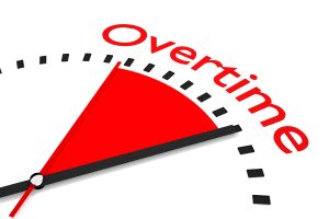 clock with red seconds hand and shaded overtime showcasing overtime or bonis in an IVA