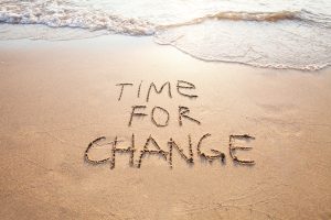 time for change written in sand showcasing if you can change an IVA