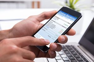 Online Banking On Smartphone showcasing what happens to your bank account in an IVA